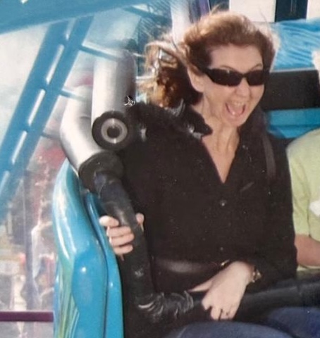 Woman laughing on roller coaster